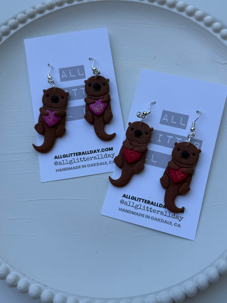 Sea otter with heart dangle