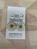 Pressed white daisy flower in resin circle dangle earring